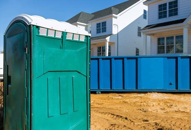 all lined up, these porta potties provide easy access for job site workers